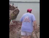 Guy falls running to lake 