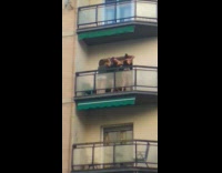 Three girls dance tiktok balcony yellow building