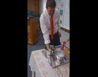 Man with fire on his hand from soap water and butane