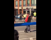 Man gives bananas to runners on marathon