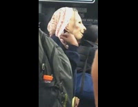 Blue sweater lady grandma costume mask bus