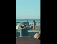 Woman black bikini photo shoot beach park