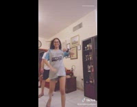 Girls dance with dad living room 