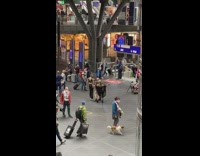 Three people weird outfit dance on airport