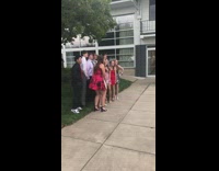 Parents take picture of kids school dance 