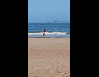 Woman bikini top tiktok dance at beach