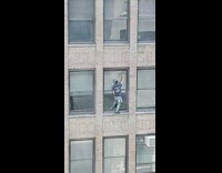 Guy cleans window from high height without harness 