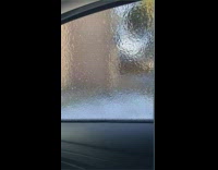 Guy in car punch ice on window