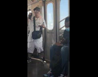 Old man sings to rap music on subway ride 