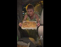 Woman is trading her focaccia bread for a printer