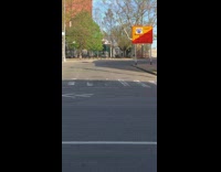 Guy plays saxophone instrument orange construction sign 