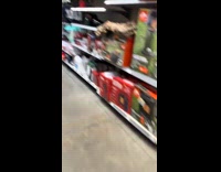 Woman tries to walk past boyfriend at store aisle