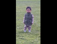 Young boy at park cry then stops quickly