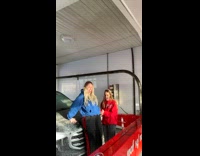 Two girls drive thru car wash red
