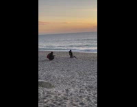 Woman sit sand stretch arms flex butt