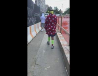 Guy walks around in Mickey robe 