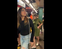 Man wearing joker costume at subway station