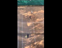 Two ladies play tennis like wii sport