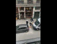 Girl long black jacket beside greenwich tavern