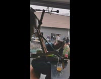 Guy uses wood contraption to pour beer 