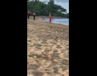 Woman red leggings hand stand beach yoga