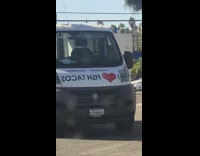 White van has decal on wrong way 