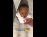 Toddler receives medicine on syringe from filmer
