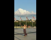 Woman walk dance selfie drop sunglasses flag