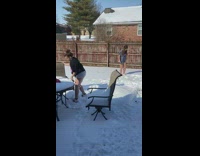 Teen girls set camera dance snow backyard