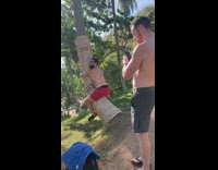 Red shorts guy hugs tree trunk tattoo 