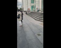 Guy hold umbrella climb stairs to hospital