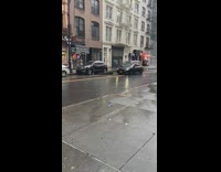 Patio furniture almost hits black car wind 