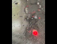 Man drive motorcycle on highway in rain downpour