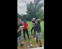 Group of guys does a beer shotgun 