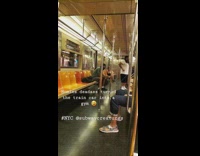 White shirt guy resistance band arm exercise 