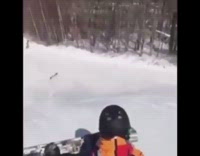 Skier jumps off ramp and lands sideways into snow, ski falls off foot