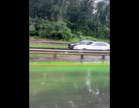 Submitter shows highway covered in green flood