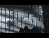 Guy brown work boots walks over vent 