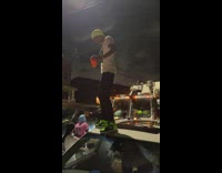 Party on street night with garbage truck