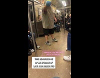 Man bunny ears asks people inside train