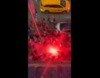 Football supporters chanting on street 