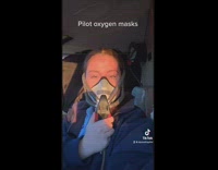 Lady Puts on Pilot Oxygen Mask in Airplane