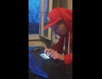 Man play rap song intro on phone piano