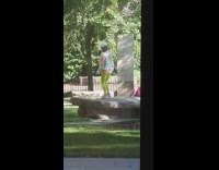 Tie dye sweater girl dances grey rock 