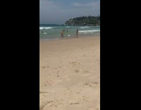 Girl jumps on beach shore for photo