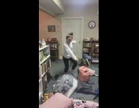 Two girls same dance  white bookshelf 