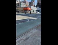 Man handstand pedestrian lane stoplight