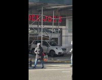 Car backed into entrance of trader joes accident