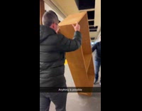 Men transporting bookshelf through subway train part 2 