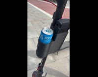 Submitter puts soda can on electric scooter bottle holder